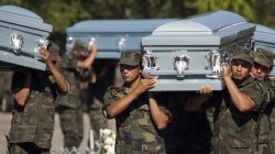 Soldiers carry coffins during the funeral of six members of Mexico's Army that were found decapitated in Chilpancingo, Mexico. More than 45,000 people have been killed by several counts, though the government stopped giving figures on drug war dead