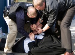 Carl Anderson, shown here being arrested during a Nov. 1 RCMP raid. (photo: KTW)