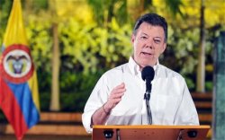 When asked if making marijuana legal could offer a way forward, President Juan Manuel Santos said it could and that he would support it.  (EPA/Felipe Ariza)